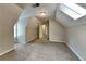 Bedroom featuring soft carpet flooring and a skylight for ample natural light at 1311 Bustling Sw Ln, Marietta, GA 30064