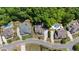 Aerial view of lovely homes with pools and landscaping with tree lined properties at 1686 Brooks Farm Nw Dr, Acworth, GA 30101