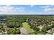 The aerial view of real estate showcases a beautiful golf course, lake and neighborhood; an invitation to idyllic living at 1686 Brooks Farm Nw Dr, Acworth, GA 30101