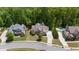 An aerial shot displays a home's landscaping and neighborhood amenities, including a sparkling community pool at 1686 Brooks Farm Nw Dr, Acworth, GA 30101