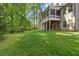 Expansive lawn and screened porch make an amazing outdoor living space for this beautiful home at 1686 Brooks Farm Nw Dr, Acworth, GA 30101