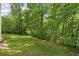 Picture of an expansive and well-manicured lawn, surrounded by lush trees offering privacy and shade at 1686 Brooks Farm Nw Dr, Acworth, GA 30101