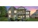 Stunning backyard with a cozy fire pit area and a screened-in porch; ideal for outdoor enjoyment at 1686 Brooks Farm Nw Dr, Acworth, GA 30101