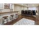 Finished basement with bar, seating area, and a projector screen at 1686 Brooks Farm Nw Dr, Acworth, GA 30101