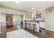Basement bar area featuring counter seating, shelving, and ping pong table for entertainment at 1686 Brooks Farm Nw Dr, Acworth, GA 30101