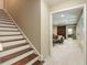 Finished basement with a staircase leading down to a seating area and a barn door at 1686 Brooks Farm Nw Dr, Acworth, GA 30101