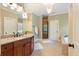 Bathroom featuring double sink vanity, soaking tub, walk-in shower and tile floors at 1686 Brooks Farm Nw Dr, Acworth, GA 30101