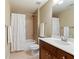 Bathroom with a single vanity, toilet, and shower-tub combo with tile surround at 1686 Brooks Farm Nw Dr, Acworth, GA 30101