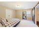Cozy bedroom with neutral colors, large mirror and sliding barn door at 1686 Brooks Farm Nw Dr, Acworth, GA 30101