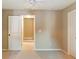 Neutral bedroom featuring a ceiling fan and an open doorway to a hallway at 1686 Brooks Farm Nw Dr, Acworth, GA 30101