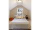 Bright bedroom with sloped ceilings, carpet, a window and wooden furniture at 1686 Brooks Farm Nw Dr, Acworth, GA 30101