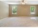 Bright and airy Primary bedroom with two windows and neutral color scheme at 1686 Brooks Farm Nw Dr, Acworth, GA 30101