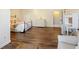 Spacious bedroom with hardwood floors, a bed, and a seating area at 1686 Brooks Farm Nw Dr, Acworth, GA 30101