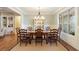 Elegant dining room with large windows, a chandelier, and space for ten at 1686 Brooks Farm Nw Dr, Acworth, GA 30101
