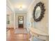 Inviting foyer with hardwood floors, white trim and view of front door at 1686 Brooks Farm Nw Dr, Acworth, GA 30101