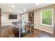 Spacious game room with ping pong table, large window, and sleek flooring at 1686 Brooks Farm Nw Dr, Acworth, GA 30101