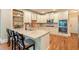 Kitchen with stainless steel appliances, granite countertops, and eat-in island with barstool seating at 1686 Brooks Farm Nw Dr, Acworth, GA 30101