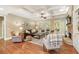 Bright living room features a coffered ceiling, fireplace, hardwood floors, and plenty of natural light at 1686 Brooks Farm Nw Dr, Acworth, GA 30101