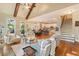 Spacious living room with stairs, kitchen, hardwood floors and a view to the outside at 1686 Brooks Farm Nw Dr, Acworth, GA 30101