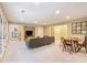 Basement living room with recessed lights, neutral carpet and adjacent dining space at 1686 Brooks Farm Nw Dr, Acworth, GA 30101