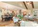 Wide shot of open concept space with kitchen, dining, and living room, featuring hardwood floors and natural light at 1686 Brooks Farm Nw Dr, Acworth, GA 30101