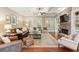 Spacious living room with a fireplace, hardwood floors, and coffered ceiling at 1686 Brooks Farm Nw Dr, Acworth, GA 30101
