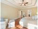 Spacious main bedroom boasting hardwood floors, a seating area, and bright natural light at 1686 Brooks Farm Nw Dr, Acworth, GA 30101