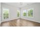 Sunlit bedroom with hardwood floors and three large windows offering a bright, open feel at 364 Glendale Ne Ave # B, Atlanta, GA 30307