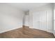 Neutral bedroom with hardwood floors, white trim and paint, and dual door closet at 364 Glendale Ne Ave # B, Atlanta, GA 30307
