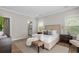 Cozy bedroom with hardwood floors, neutral decor, and an ensuite bathroom at 364 Glendale Ne Ave # B, Atlanta, GA 30307