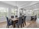 Open-concept dining area with hardwood floors, stylish lighting, and seamless flow to the kitchen at 364 Glendale Ne Ave # B, Atlanta, GA 30307