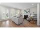 Bright living room with hardwood floors, fireplace, and French doors leading to the outside at 364 Glendale Ne Ave # B, Atlanta, GA 30307