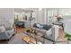Open-concept living room featuring a fireplace, hardwood floors, and seamless flow to the kitchen at 364 Glendale Ne Ave # B, Atlanta, GA 30307