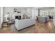 Open-concept living room features hardwood floors, a fireplace, built-in shelves, and a center island at 364 Glendale Ne Ave # B, Atlanta, GA 30307
