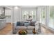 Open-concept living room featuring a fireplace, hardwood floors, and seamless flow to the kitchen at 364 Glendale Ne Ave # B, Atlanta, GA 30307