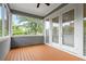 Cozy screened-in porch with a wood floor, offering a serene outdoor retreat with ample natural light at 364 Glendale Ne Ave # B, Atlanta, GA 30307