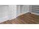 Walk-in closet with custom shelving, drawers, and hardwood floors at 364 Glendale Ne Ave # B, Atlanta, GA 30307