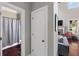 Bathroom view featuring a shower with gray curtain and dark floors at 944 Hidden Falls Se Ln, Smyrna, GA 30082