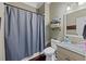 Cozy bathroom with a shower, toilet, vanity, and mirror with neutral tones at 944 Hidden Falls Se Ln, Smyrna, GA 30082