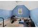Bedroom painted blue with exercise equipment at 944 Hidden Falls Se Ln, Smyrna, GA 30082