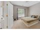 Carpeted bedroom with ensuite access to a bathroom at 944 Hidden Falls Se Ln, Smyrna, GA 30082