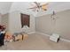 Carpeted bedroom with a ceiling fan at 944 Hidden Falls Se Ln, Smyrna, GA 30082