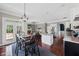 Kitchen and dining area featuring stainless appliances, a kitchen island, and seamless access to the living area at 944 Hidden Falls Se Ln, Smyrna, GA 30082