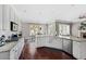 Inviting eat-in kitchen with an island, stainless appliances, and seating open to the living room at 944 Hidden Falls Se Ln, Smyrna, GA 30082
