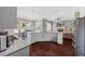 Eat-in kitchen showcasing stainless appliances, granite countertops, and views into the living area at 944 Hidden Falls Se Ln, Smyrna, GA 30082