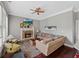 Cozy living room with fireplace, plush seating, and a ceiling fan at 944 Hidden Falls Se Ln, Smyrna, GA 30082