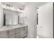 Bathroom with double vanity sinks, modern lighting, and tile flooring at 1225 Chelsea Nw Cir, Atlanta, GA 30318