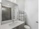 Modern bathroom featuring a shower over tub, large mirror, and a gray vanity at 1225 Chelsea Nw Cir, Atlanta, GA 30318