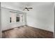 An empty room featuring hardwood floors, white walls, and a modern ceiling fan fixture at 1225 Chelsea Nw Cir, Atlanta, GA 30318