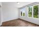 Bedroom with three large windows, hardwood floors, and bright white walls at 1225 Chelsea Nw Cir, Atlanta, GA 30318